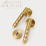 Two gold diamond knurled door handles